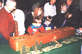 Model of Noahs Ark, with trees and animals to scale, with fascinated onlookers
