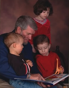 Ken reading to his grandchildren.