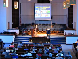 Dr. Mitchell speaking to First Baptist Church